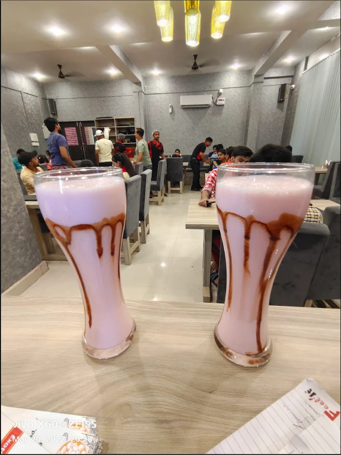 Clean family dining table setup at Food Express restaurant in Dudhi
